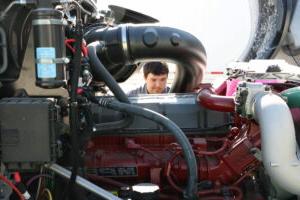 A student working on an engine.